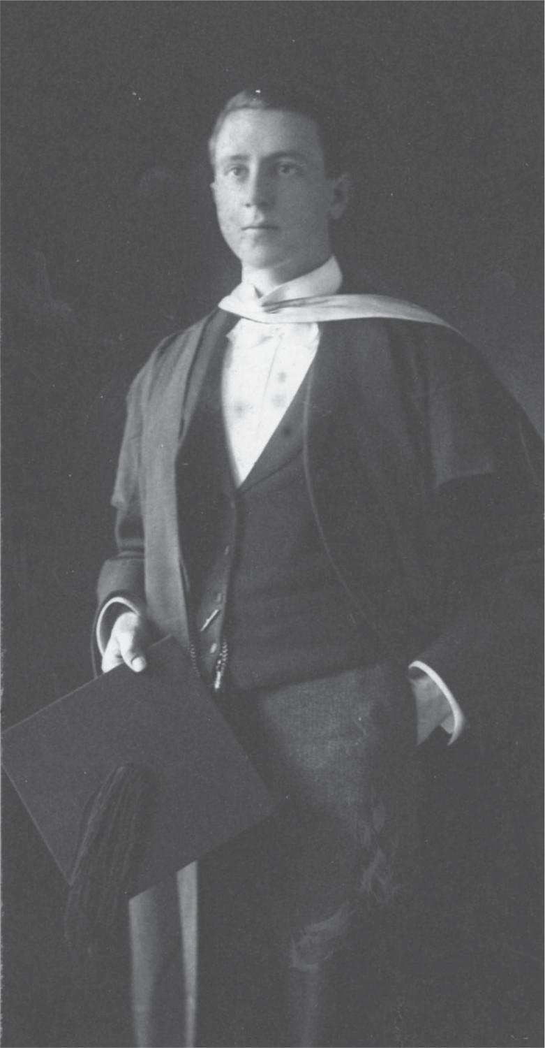 Black and white photograph of Alexander Mackie wearing a black suit and graduation gown and holding a graduation cap.