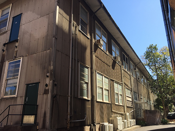 Photograph of a building with brown corrugated cladding.