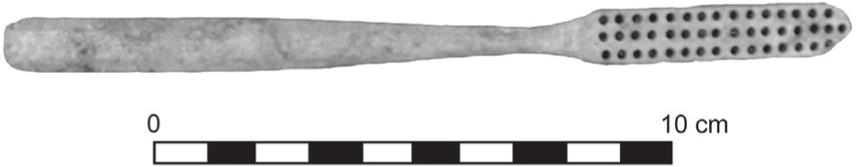 A black and white photograph of a toothbrush without its bristles. It is just over ten centimetres.