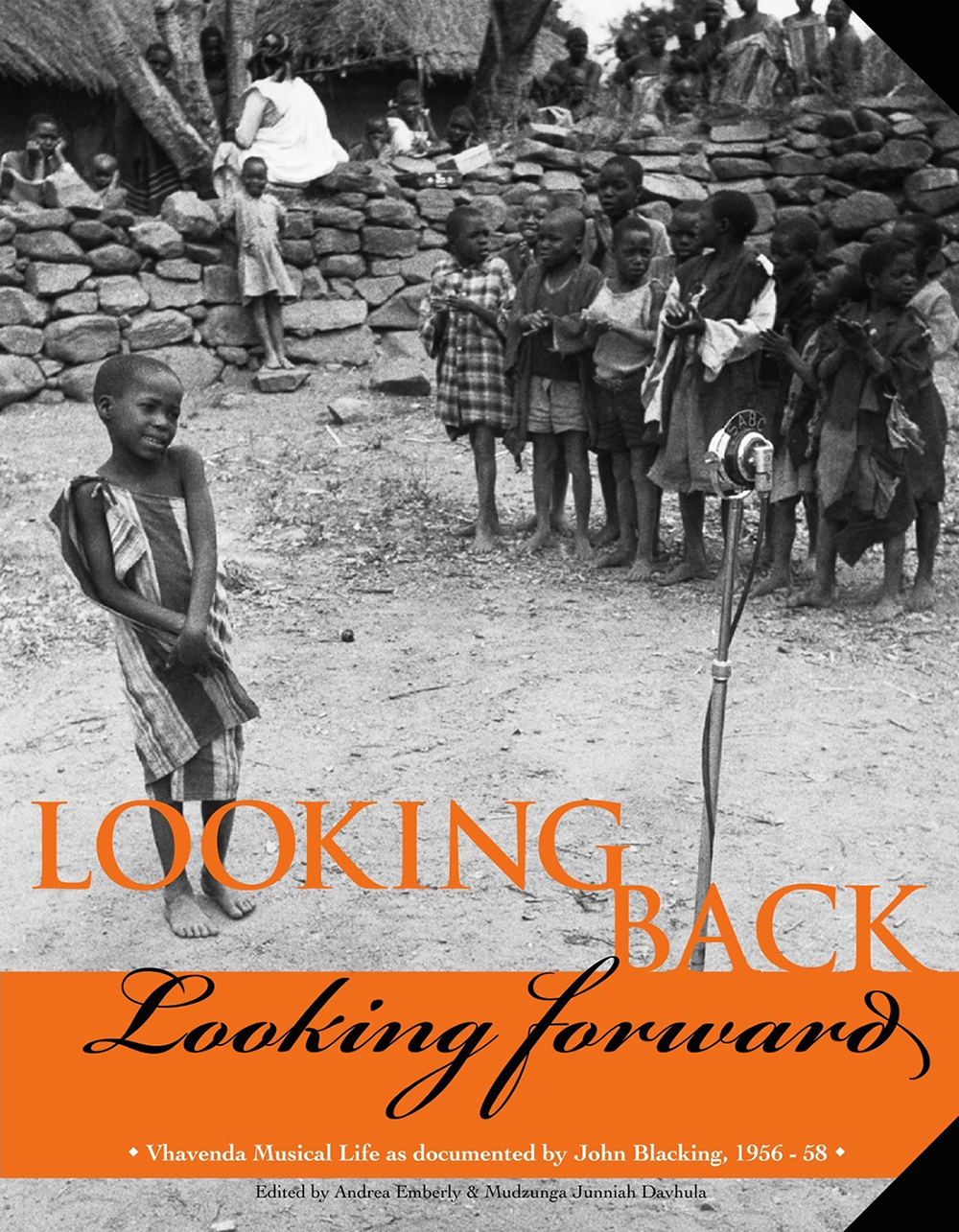 Figure 7.4. The background image of the flyer shows a young girl of about 8 singing shyly into an old-fashioned microphone while her peers look on. The text is the title of the exhibition, Looking Back, Looking Forward, Vhavenda Musical Life as documented by John Blacking, 1956 to 58. 