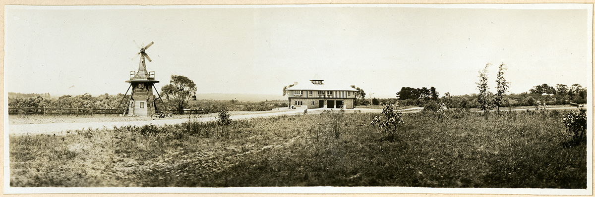 Photograph of a windmill on a property in 1925.