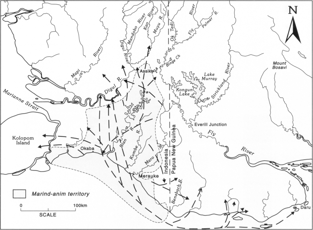 Map at scale of 1 inch to 100km showing the coastal regions of Indonesia to the left and Papua New Guinea to the right, as separated by a vertical dotted line. The shaded area bordered by small dotted lines around the Indonesian coast is demarcated as the Marind-anim territory. Bold long dotted-lined arrows point forth the trading routes from places like Merauke in Indonesia to domestic areas like Kolopom Islands, Digul River, Assike, Muyu River in the Indonesia, and also to Daru and several other places in Papua New Guinea. 