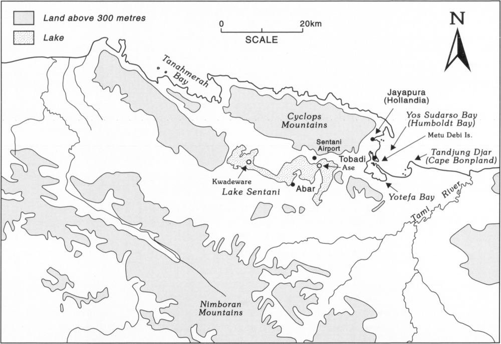 Map at a scale of 1 inch to 20km showing the coastal Jayapura region, with Tanahmerah Bay on the top left side, northwest of Cyclops Mountains, Jayapura, also known as Hollandia, on the coast east of Cyclops Mountains, and Yos Sudarso Bay, or Humboldt Bay towards the right side of the map. Lake Sentani, marked in a shade of tiny dots, spread across an area south of Cyclops Mountain. 