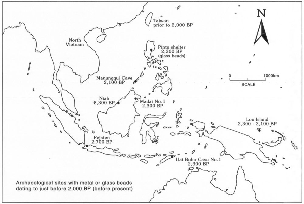 Map showing archaeological sites of metal or glass beads dating to just before 2,000 BP that are evidence of new development. The places shown on the map are, from north to south: Taiwan prior to 2,000 BP, Pintu shelter in the northern islands of the Philippines 2,300 BP (glass beads), Manunggul Cave in the southwest of the Philippines 2,100 BP, Niah 2,300 BP northwest of the island of Borneo, Maidai No.1 2,300 BP in northeastern Borneo, Pejaten 2,700 BP on the north-eastern coast of Java in Indonesia, Uai Bobo Cave 2,300 BP in the eastern side of Timor, and Lou Island 2,300 to 2,100 BP on the tiny islands north-east of New Guinea.