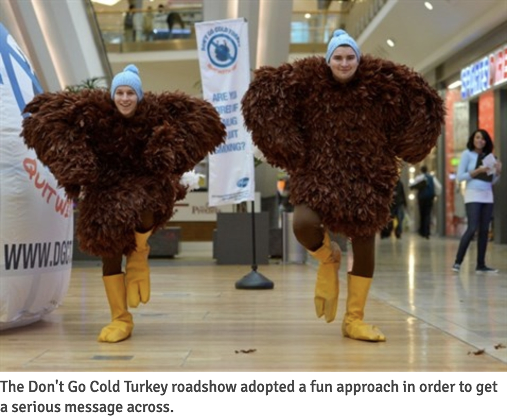 A colour photograph of two people dressed as turkeys. They are running through a shopping centre. Below the photograph is the text: "The Don't Go Cold Turkey roadshow adopted a fun approach in order to get a serious message across"