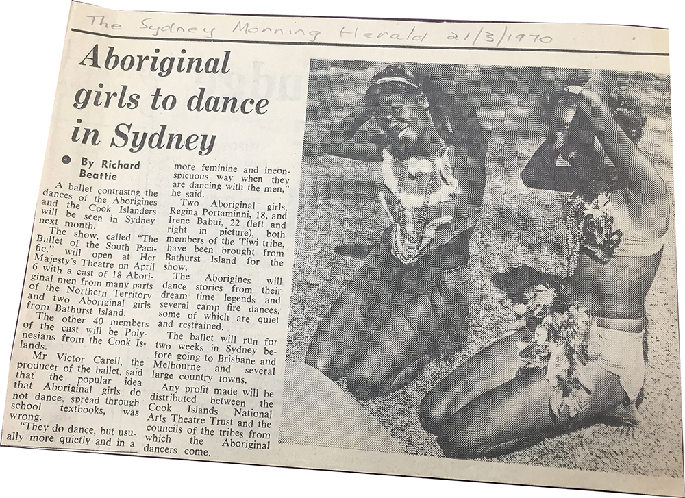 A clipping of an article titled “Aboriginal girls to dance in Sydney”, written by Richard Beattie. Scribbled at the top of the clipping in pencil are the words "The Sydney Morning Herald 21/3/1970". The image on the right-hand side of the newspaper clipping shows two Aboriginal girls in ceremonial dress – Regina Portaminni and Irene Babui. They are smiling and their hands are on their heads.