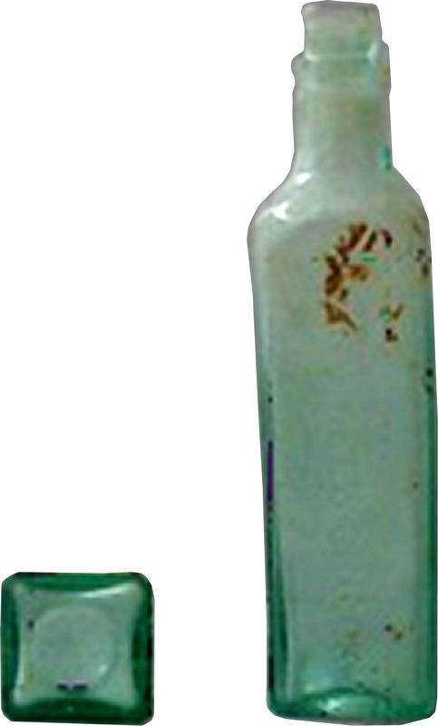 Two perspectives of a tall bottle. The first perspective shows the base of the bottle, which is square with a circular indentation. The second perspective shows the a side view of the bottle, which has a short neck, closed with a lid or cork. There are dark markings near the shoulder of the bottle.