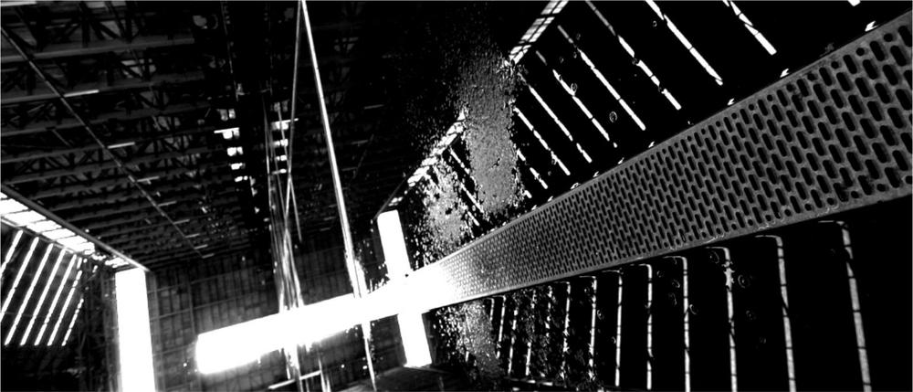 A black and white photograph of the framework of a biulding.