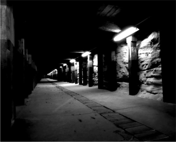 A black and white photograph of an access tunnel through Cockatoo Island.