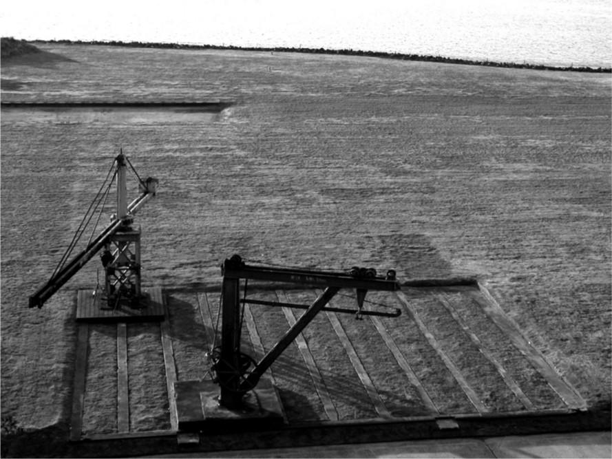 A black and white photograph of a slipway.