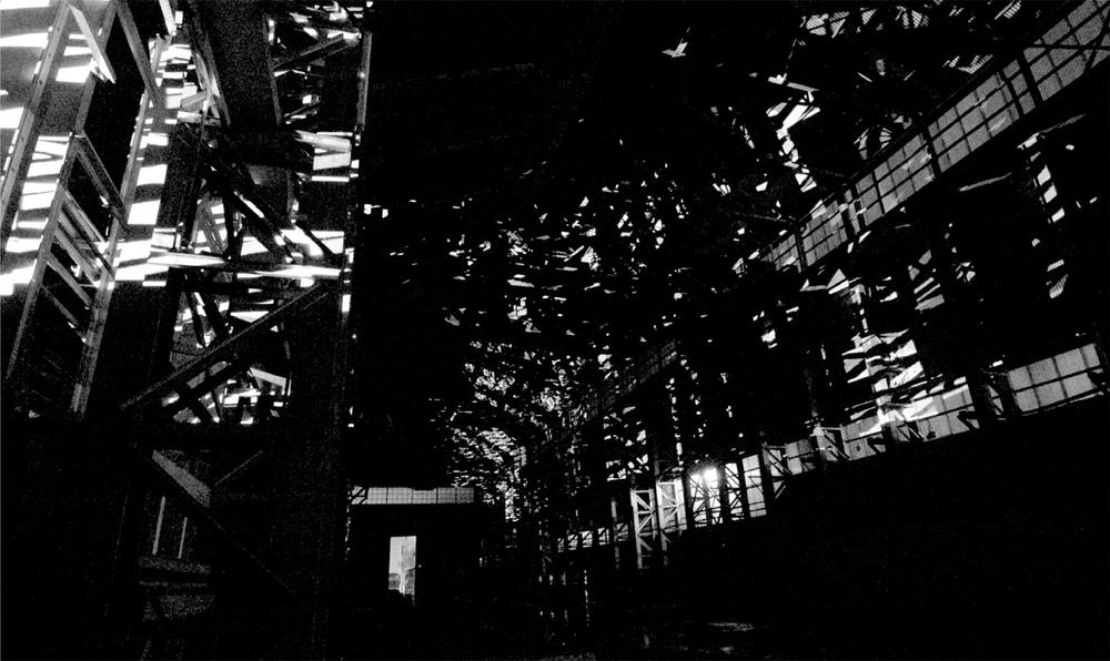 A black and white photograph of a large open building.