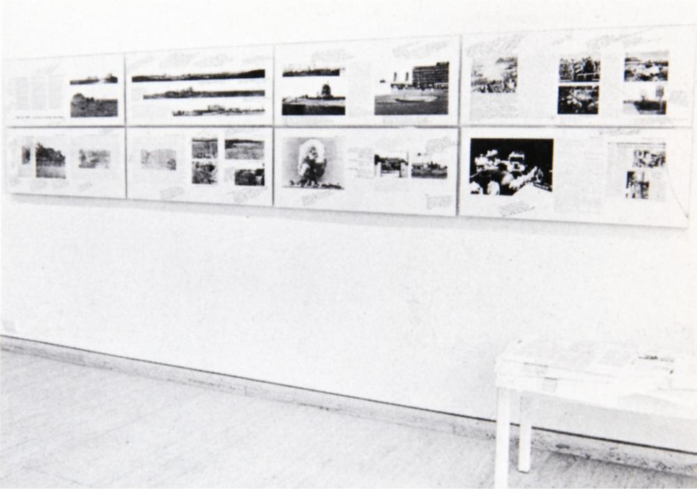 A photograph of a room with a photo display on the wall.