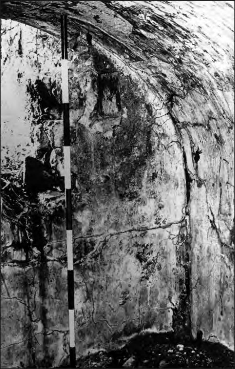 A black and white photograph of the magazine's interior; it has a curved ceiling and a striped pole resting from the ground to the roof.