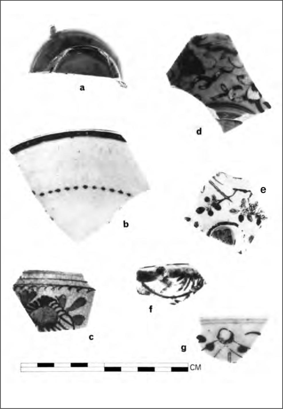 A black and white photograph of seven shards of pottery. Most of them have floral patterns and one has a dotted line.