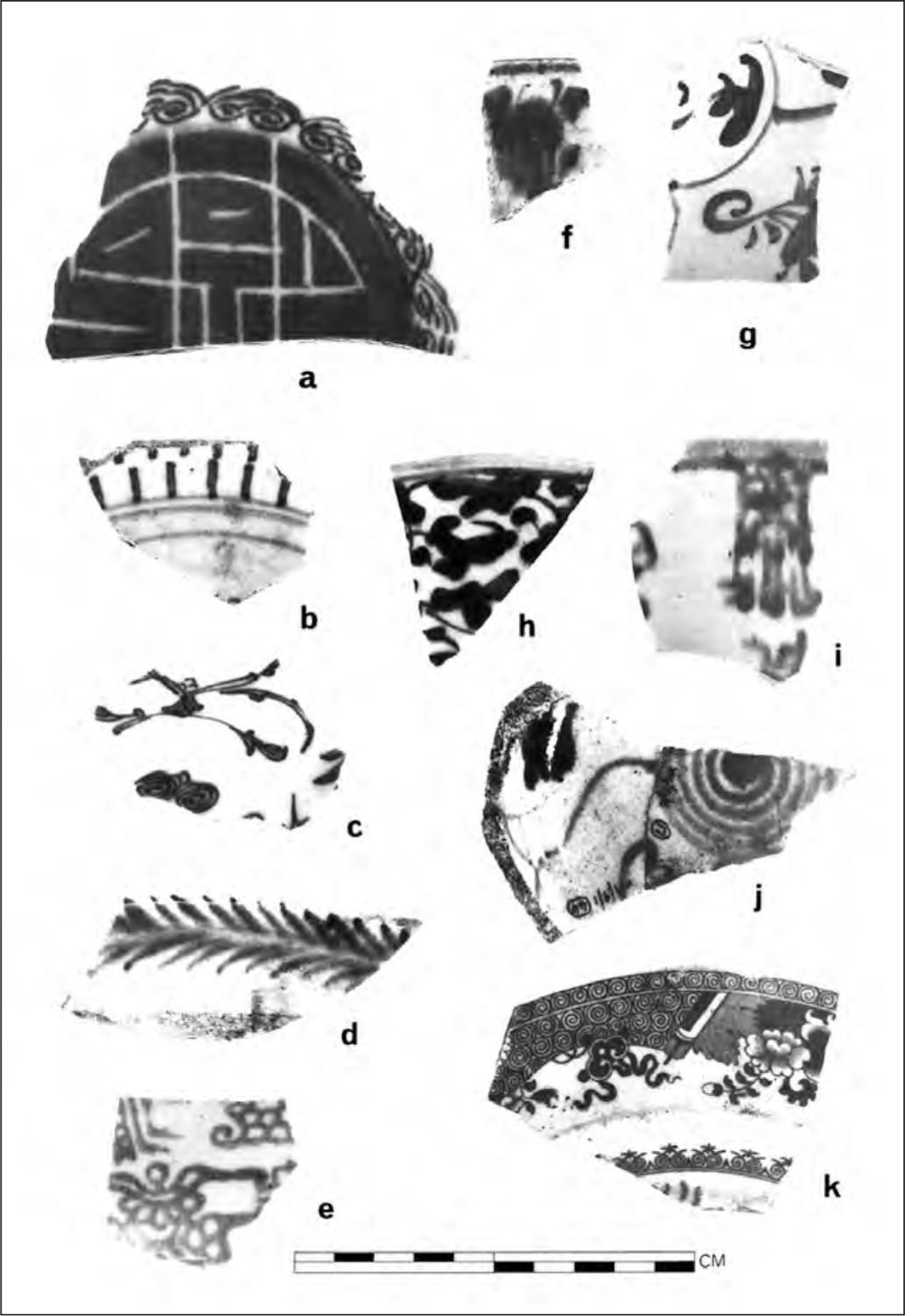 A black and white photograph of seven shards of pottery. Most of them have floral patterns.