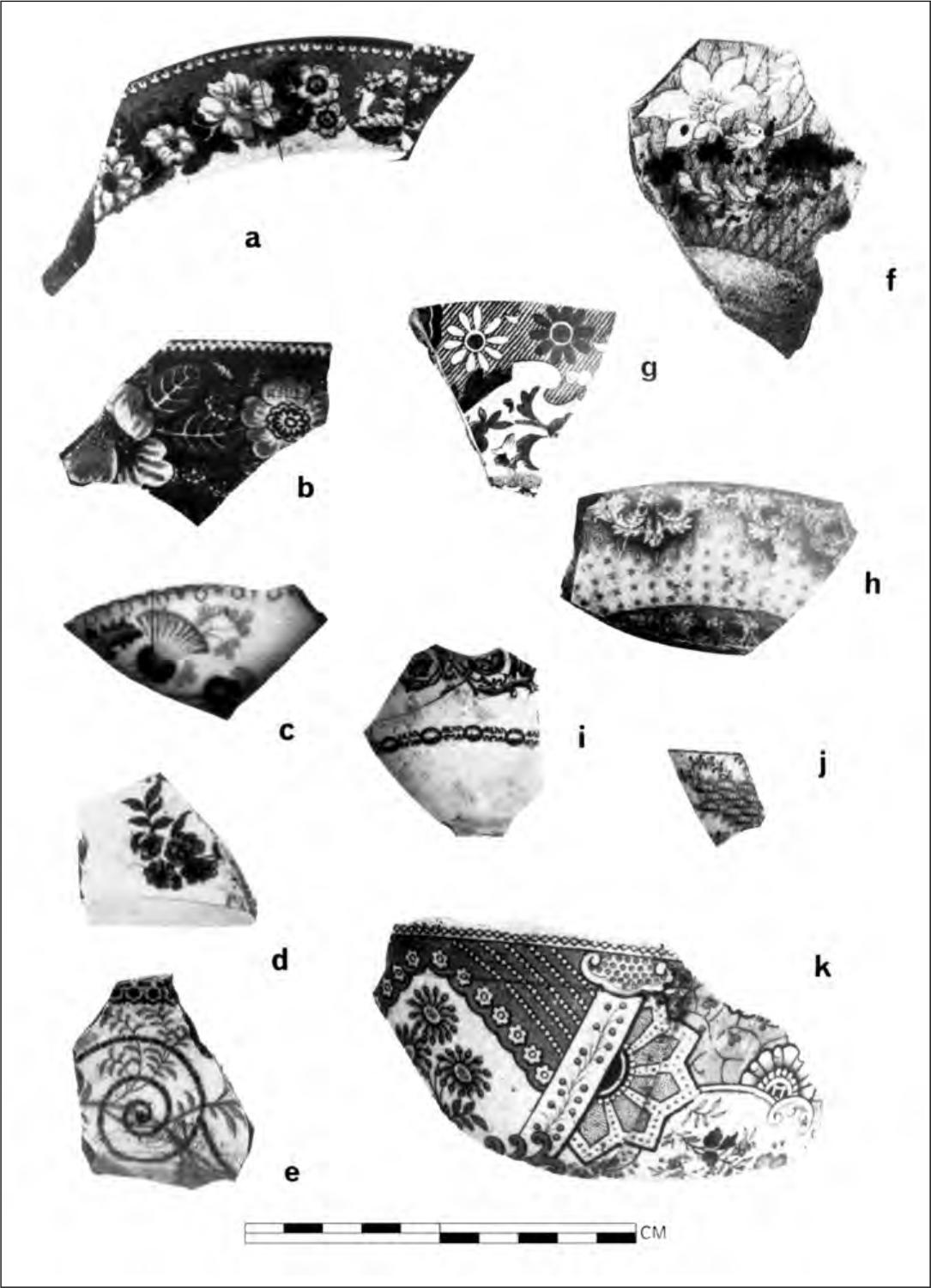 A black and white photograph of 11 pottery shards with uniquely detailed floral patterns. 