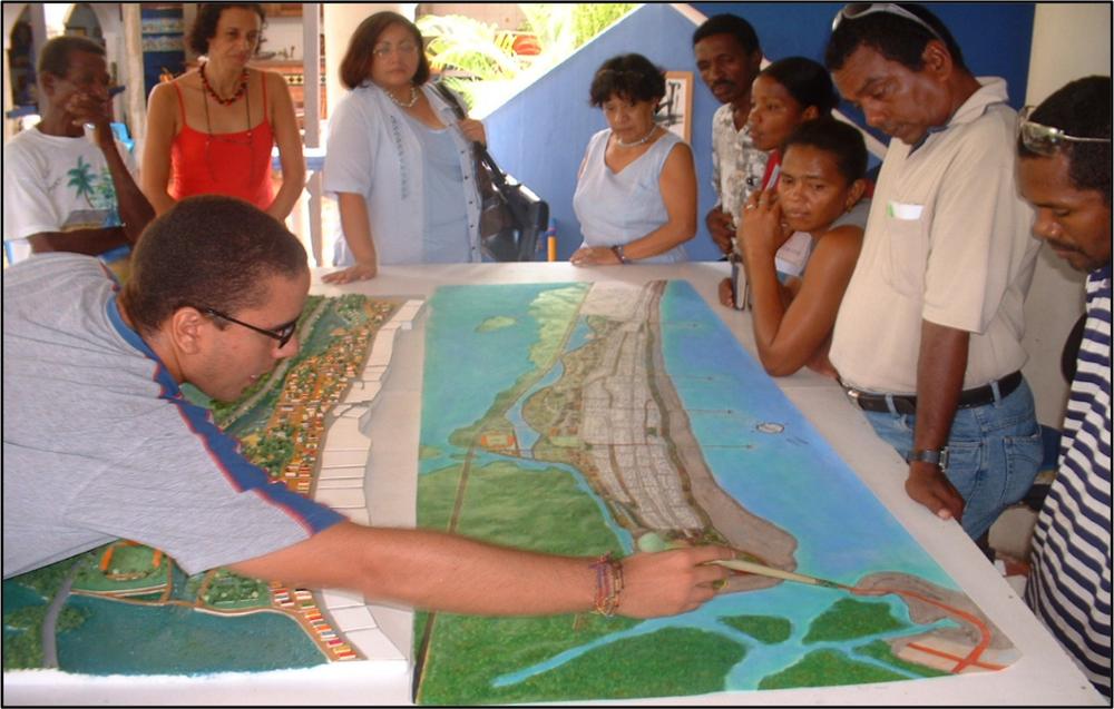 A photograph of students presenting the project to community leaders.