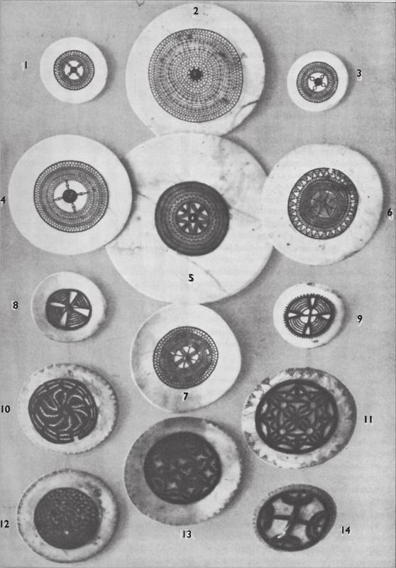 Black and white image of various chest ornaments.