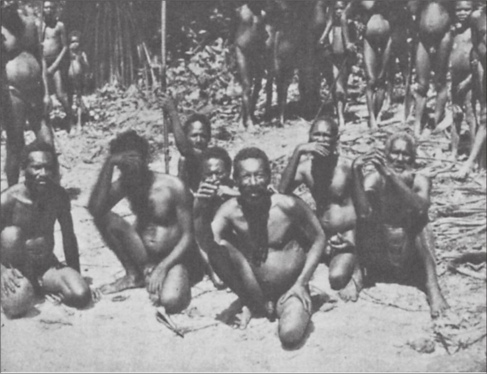 Black and white image of a group of men sitting on the Island.