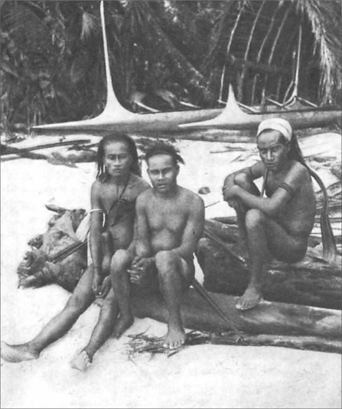 Black and white image of three young people sitting on the beach of the island.
