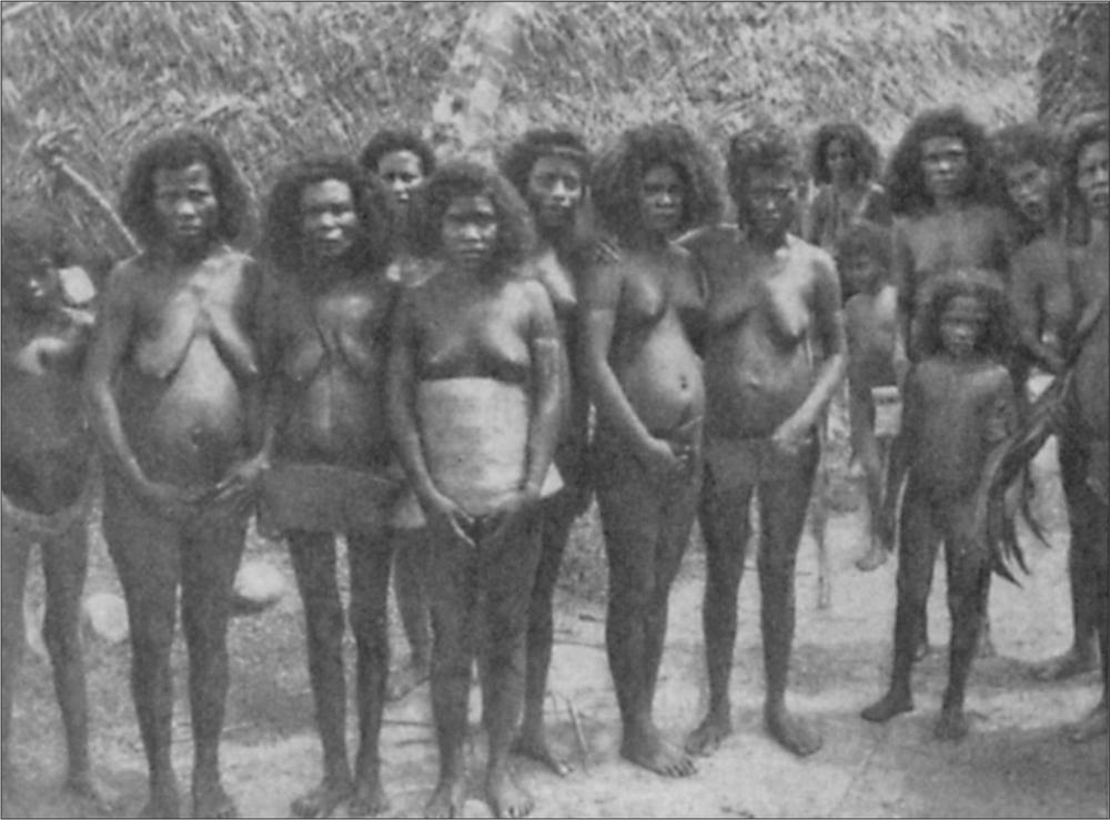 Black and white image of a group of women standing and posing for the camera.