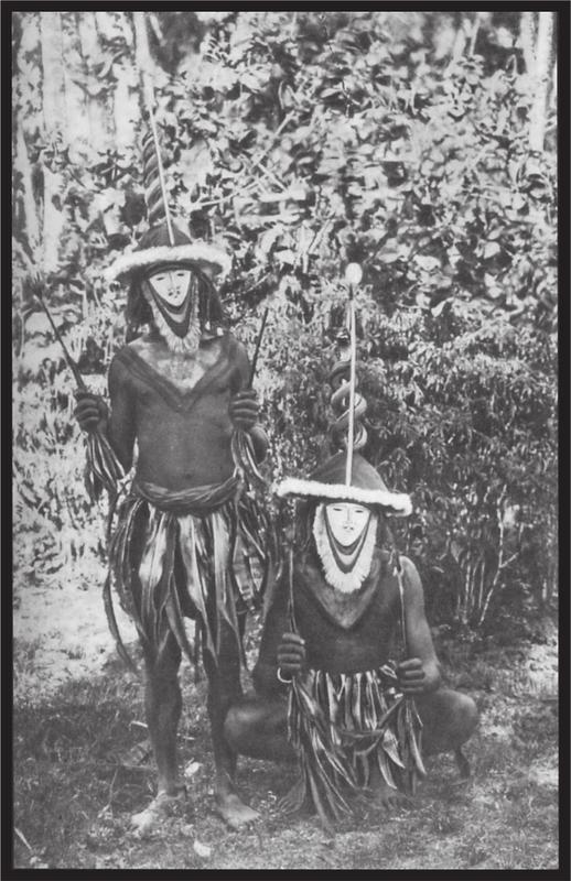 Black and white image of two dancers with masks.