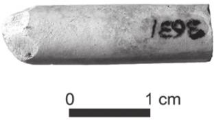 A black and white photograph of a clay pipe broken into a short stub.