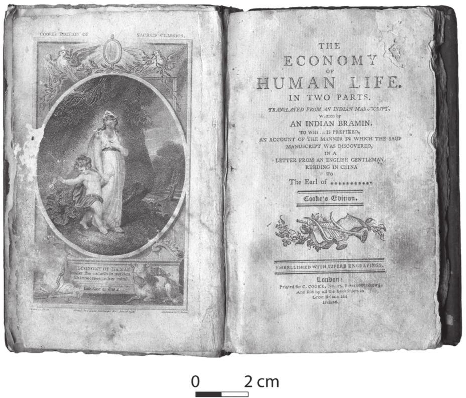 A black and white photograph of an open book. The left page has an image of a woman holding the hand of a child. The right page has the heading: The Economy of Human Life in Two Parts. 