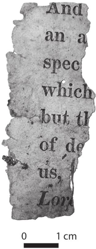 A black and white photograph of a fragment of a page. 