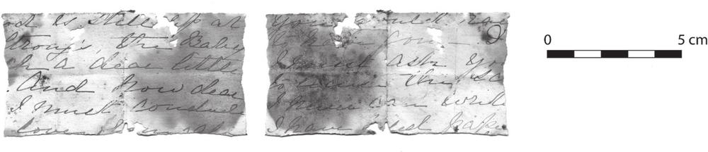 A black and white photograph of two pages of a letter torn in half.
